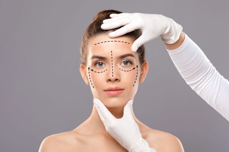 Young woman with face marks getting treatment at beauty clinic
